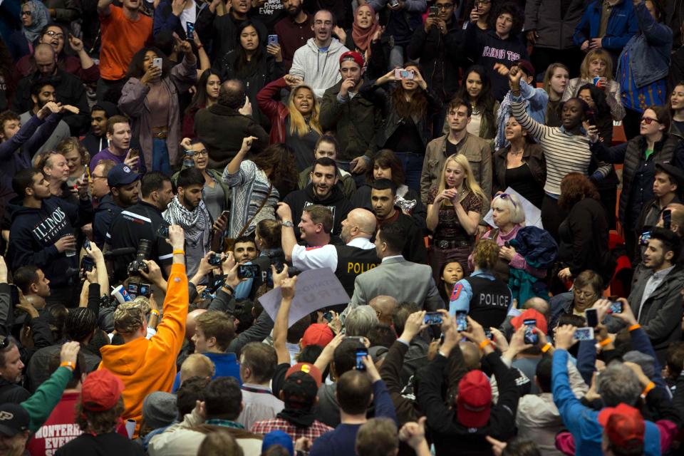 Anti-Donald Trump protesters and his supporters confront during a Trump rally at the UIC Pavilion in Chicago on March 11, 2016.