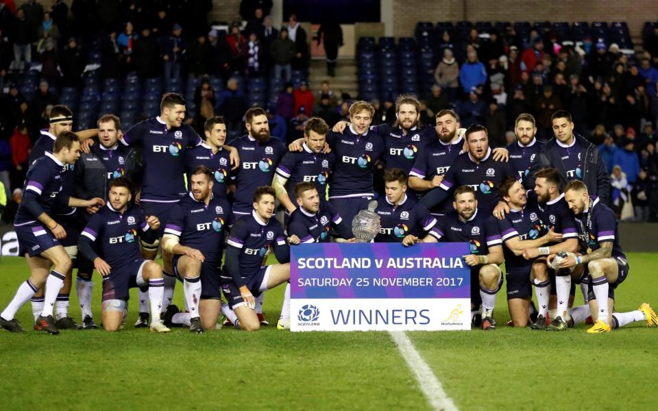 Scotland celebrate their crushing victory over Australia  - REUTERS