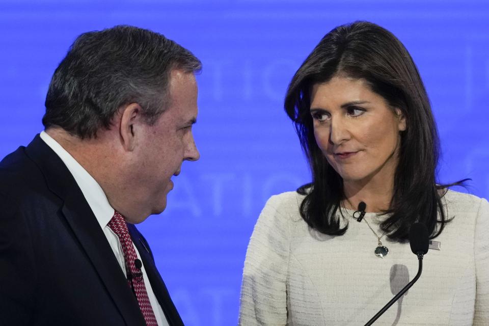 Republican presidential candidates, former New Jersey Gov. Chris Christie, left, talking with former U.N. Ambassador Nikki Haley, right, during a commercial break at a Republican presidential primary debate hosted by NewsNation on Wednesday, Dec. 6, 2023, at the Moody Music Hall at the University of Alabama in Tuscaloosa, Ala. | Gerald Herbert, Associated Press