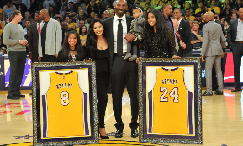 Kobe Bryant and Vanessa Bryant with their children at the Staples Center.