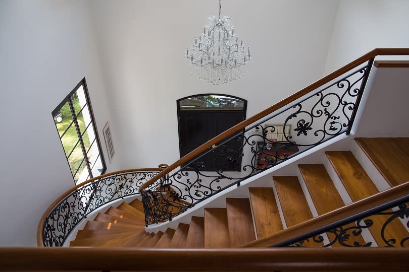 The grand staircase at the foyer of the house at Yarwood Avenue