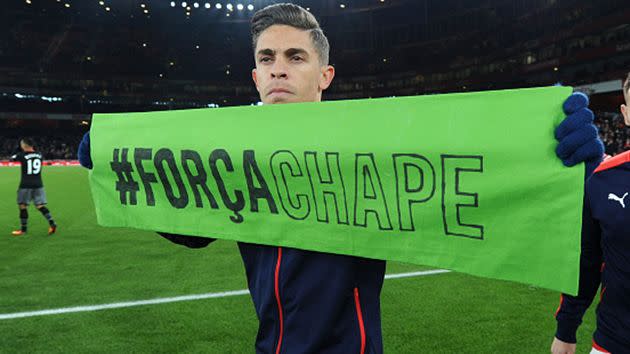 Gabriel holds a banner to commemorate the victims. Image: Getty