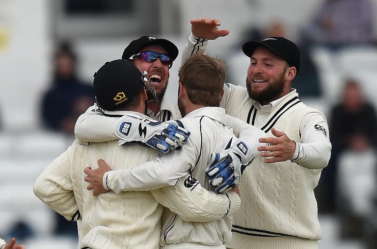 New Zealand celebrate the dismissal of England's Alastair Cook on the fifth and final day of the second Test at Headingley on June 2, 2015