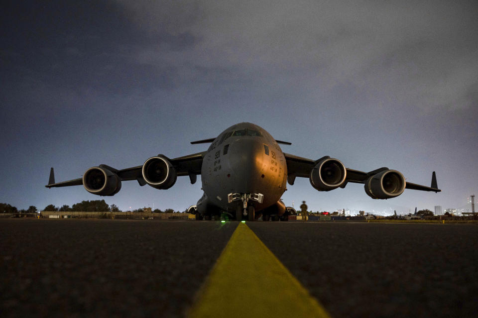 In this Aug. 30, 2021, photo provided by the U.S. Air Force, a Air Force C-17 Globemaster III aircrew, assigned to the 816th Expeditionary Airlift Squadron, prepares to receive soldiers, assigned to the 82nd Airborne Division, to board at Hamid Karzai International Airport in Kabul, Afghanistan. (Senior Airman Taylor Crul/U.S. Air Force via AP)