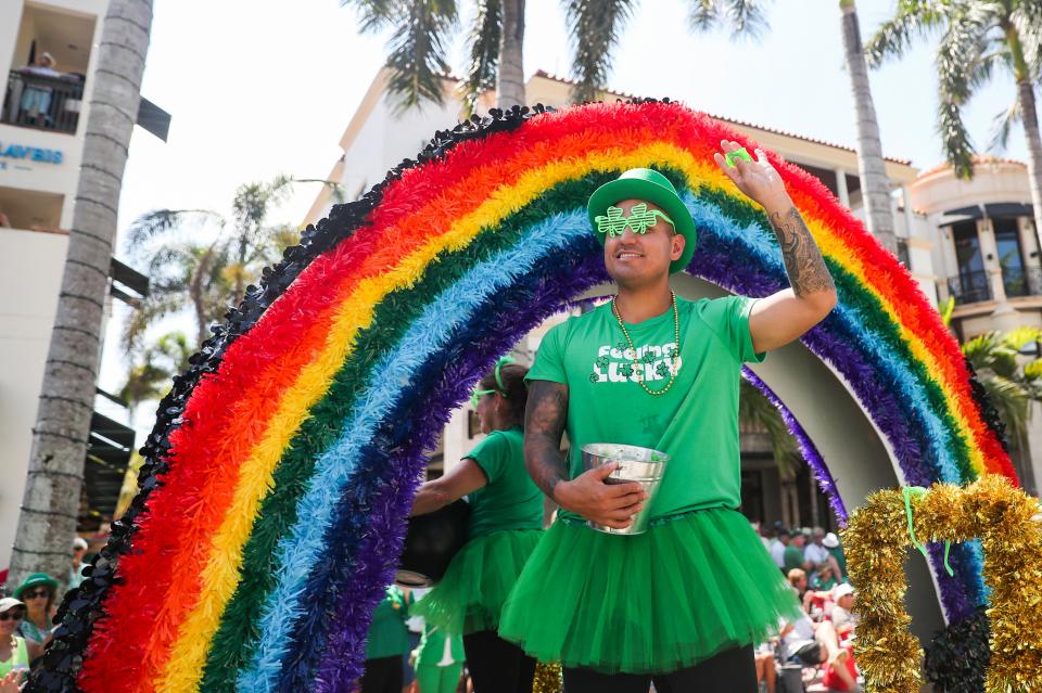 People attend the St. Patrick’s Day Parade in downtown Naples on Saturday, March 11, 2023. 