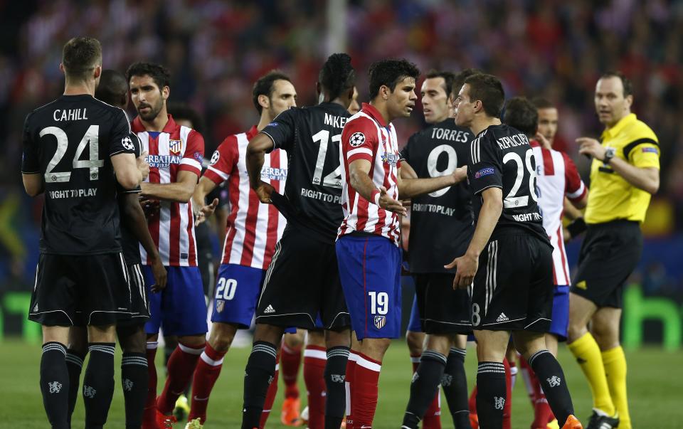 Chelsea and Atletico players argue during the Champions League semifinal first leg soccer match between Atletico Madrid and Chelsea at the Vicente Calderon stadium in Madrid, Spain, Tuesday, April 22, 2014. (AP Photo/Andres Kudacki)