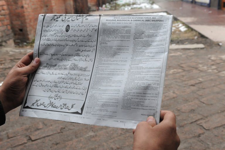 A Kashmiri Muslim reads a notice with instructions concerning a response to nuclear weapons issued by the police in Srinagar on January 22, 2013. Police in Indian Kashmir have warned residents to build underground bunkers to prepare for a possible nuclear war in the disputed region, which is on edge after a string of deadly border clashes