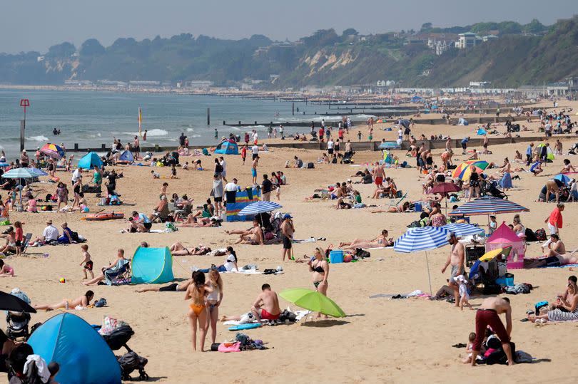People enjoying the sunny weather on Bournemouth Beach in Dorset. Picture date: Sunday May 12, 2024.