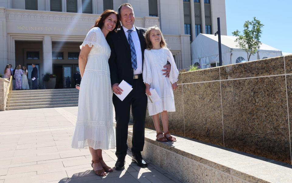 Janae and Sebastin Nilsson and their daughter Mimi pose for photos after the first session of the dedication of the Saratoga Springs Utah Temple in Saratoga Springs, Utah, on Sunday, Aug. 13, 2023. | Scott G Winterton, Deseret News