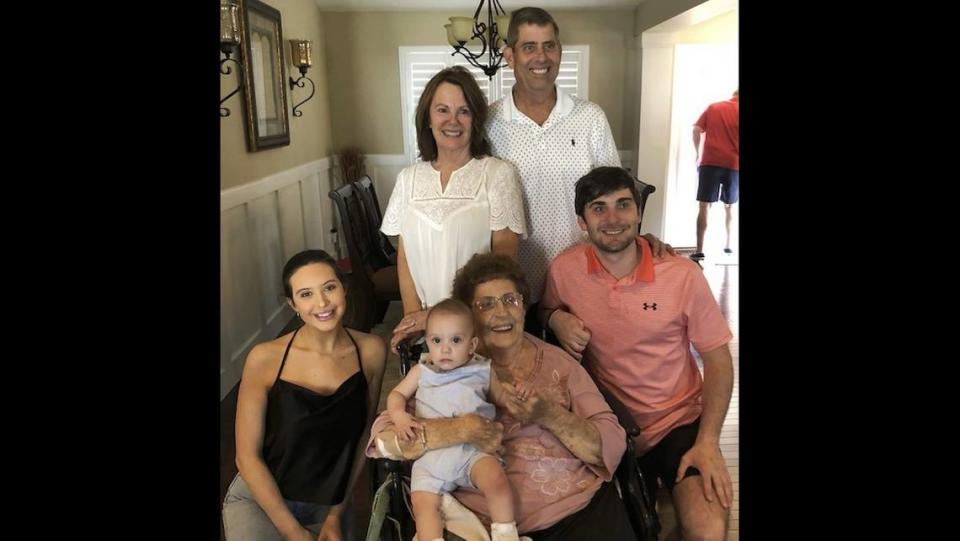 Clayton Augustine, right, poses with his parents, Debbie and Robert Augustine, clockwise from top left, his grandmother, Marlene Augustine, son Nolan and fiance Sarah Lamonica before he died of a drug overdose in 2021.