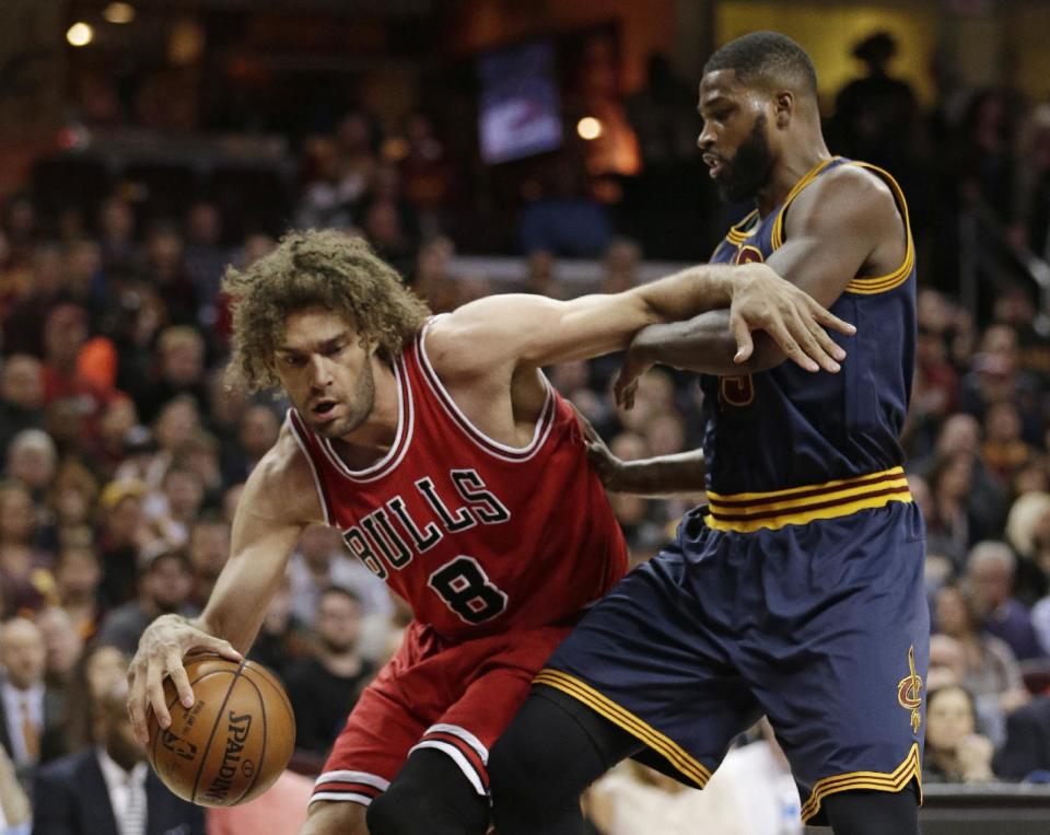 Chicago Bulls' Robin Lopez (8) tries to get past Cleveland Cavaliers' Tristan Thompson (13) in the first half of an NBA basketball game, Saturday, Feb. 25, 2017, in Cleveland. (AP Photo/Tony Dejak)