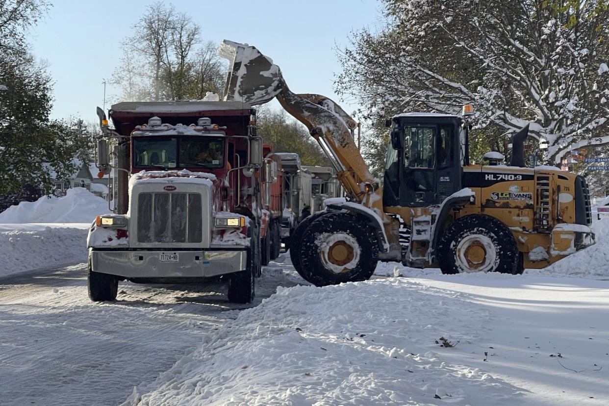 Snow removed from the street in Buffalo, N.Y. on Saturday, Nov. 19, 2022. Residents of northern New York state are digging out from a dangerous lake-effect snowstorm that had dropped nearly 6 feet of snow in some areas and caused three deaths. The Buffalo metro area was hit hard, with some areas south of the city receiving more than 5 feet by early Saturday. (AP Photo/Carolyn Thompson)