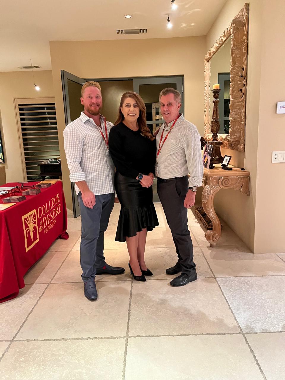 Host Duke Kulas and Tom Minder welcome College of the Desert President Martha Garcia at the College of the Desert Foundation, Presidents Circle event Nov. 10, 2022.