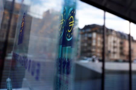 FILE PHOTO: Reflection of the sign of the European Central Bank (ECB) is seen ahead of the news conference on the outcome of the Governing Council meeting, at the ECB headquarters in Frankfurt