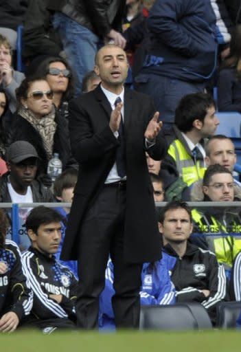 Chelsea's care-taker manager Roberto Di Matteo cheer his team during their FA Cup 6th round match against Leicester City at Stamford Bridge in West London, on March 18. Chelsea won 5-2