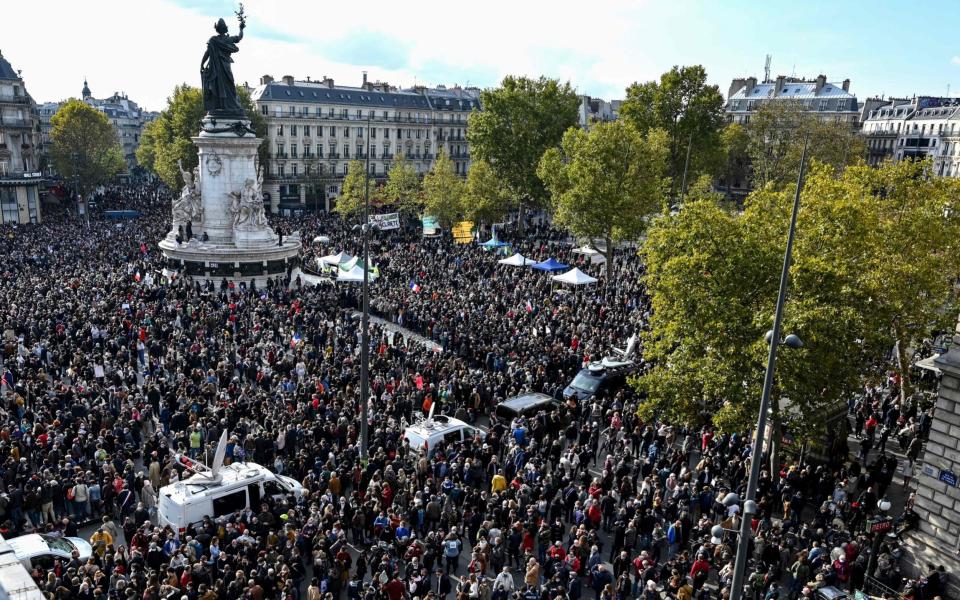 Gathering in Place de la Republique in Paris on October 18, 2020 in tribute to history teacher Samuel Paty two days after he was beheaded - BERTRAND GUAY/AFP