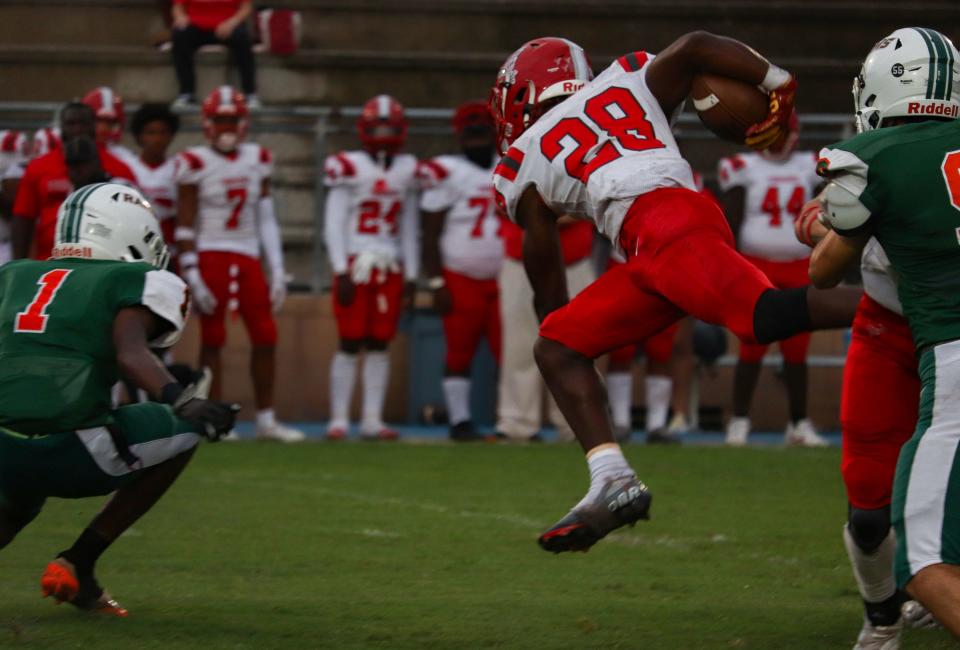 Bradford Tornadoes Manny Covey (28) jumps with the ball during a game against Bradford High School at Citizens Field in Gainesville, FL., on Friday, Sept. 16, 2022.  [Lauren Witte/Special to the Gainesville Sun]