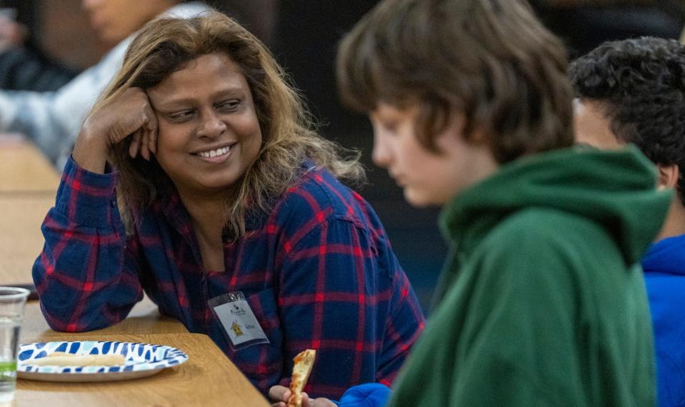 Grace Dickson chats with young people, including her son Matthew Dickson, 12, on Monday, Dec. 12, 2022, at a meeting for Brooke’s Place, which helps grieving young people. Dickson’s husband died in late December of 2021, and Matthew, who was present when his father had a fatal heart attack, is working through various activities with the program. 