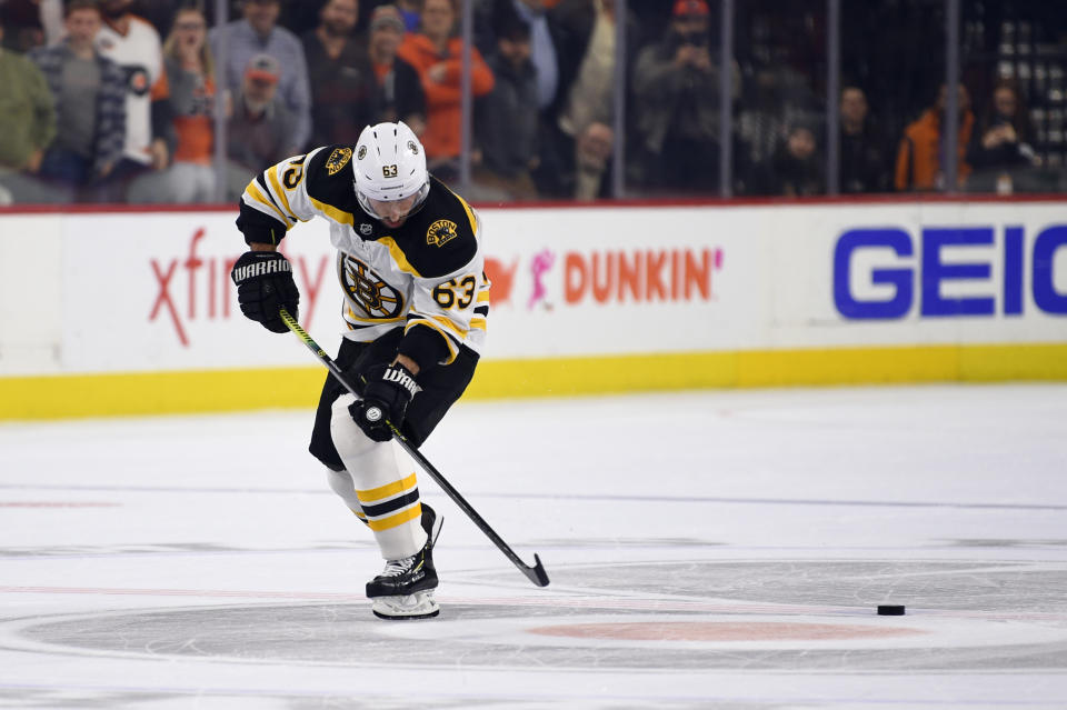 Boston Bruins' Brad Marchand skates by the puck on a shootout attempt in an NHL hockey game against the Philadelphia Flyers, Monday, Jan. 13, 2020, in Philadelphia. The Flyers won 6-5. (AP Photo/Derik Hamilton)