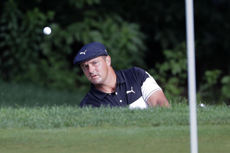 Bryson DeChambeau chips on the 10th green during the first round of the Travelers Championship golf tournament at TPC River Highlands, Thursday, June 25, 2020, in Cromwell, Conn. (AP Photo/Frank Franklin II)