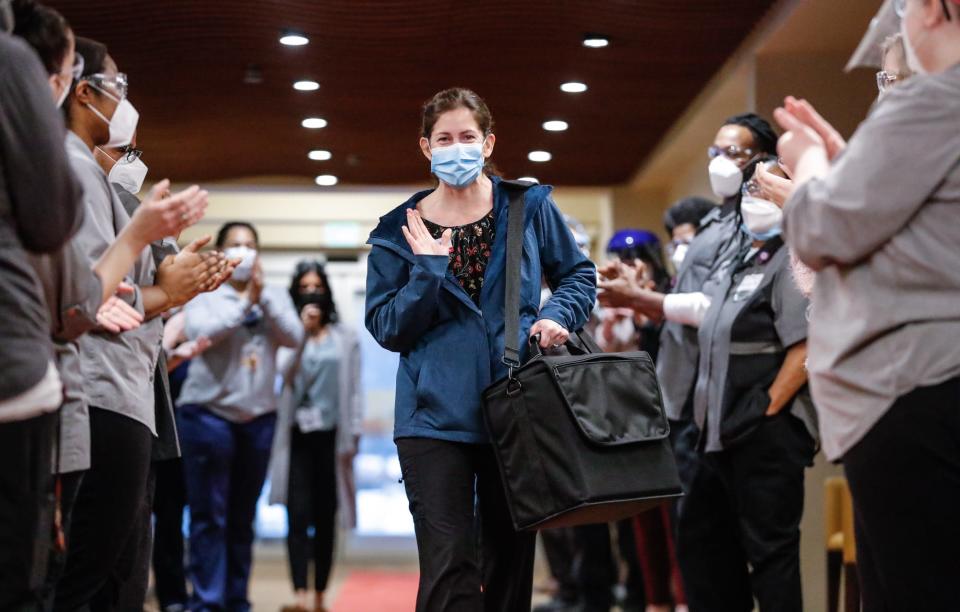 CVS Pharmacist Lisa Rounds, walks a red carpet to inspirational music as she arrives with   the Moderna COVID-19 Vaccine, Friday, January 8, 2021, at the Hooverwood Living assisted living facility, 7001 Hoover Rd. in Indianapolis. Friday was the first-day seniors and staff were able to get the vaccine at the facility. 