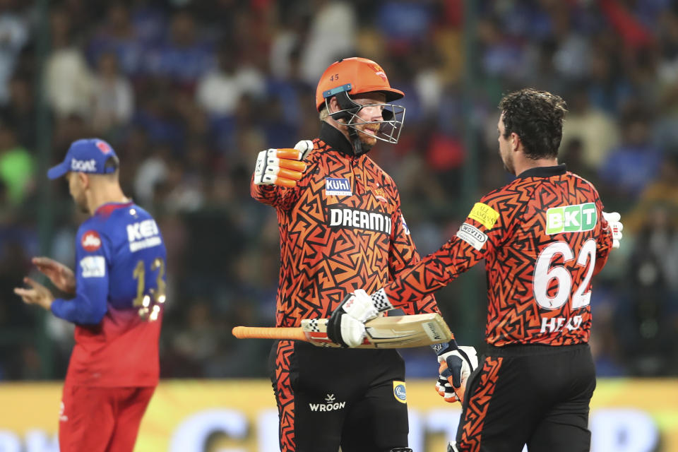 Sunrisers Hyderabad's Heinrich Klaasen congratulates Travis Head for scoring a century during the Indian Premier League cricket match between Royal Challengers Bangaluru and Sunrisers Hyderabad in Bengaluru, India, Monday, April 15, 2024. (AP Photo/Kashif Masood)