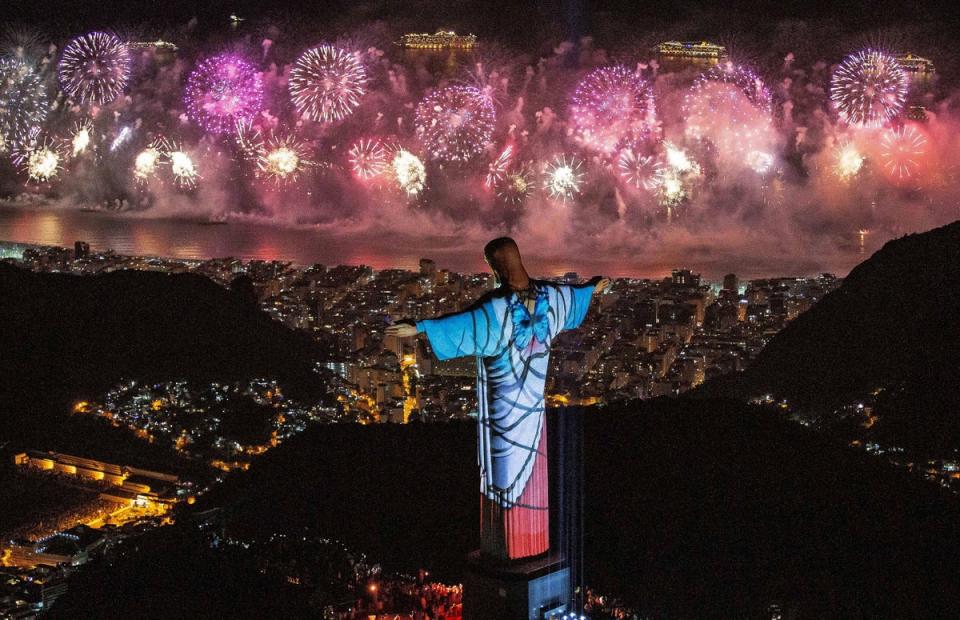 A fireworks display behind Christ the Redeemer during New Year’s Eve celebrations in Rio de Janeiro, Brazil (EPA)