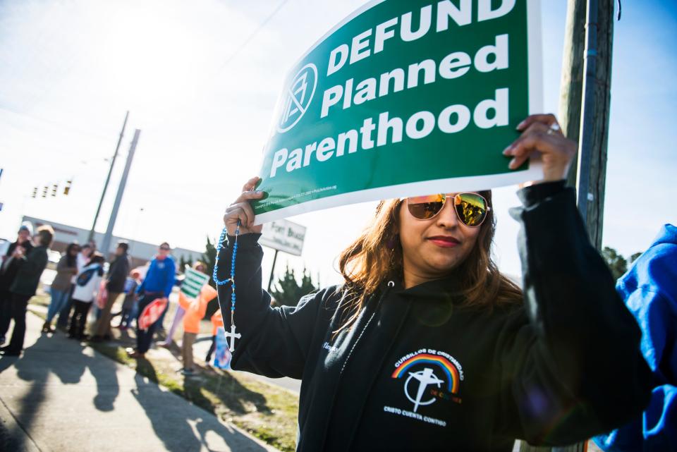 Demonstrators host a rally against abortion in front of the Planned Parenthood offices in Fayetteville in February 2017.
