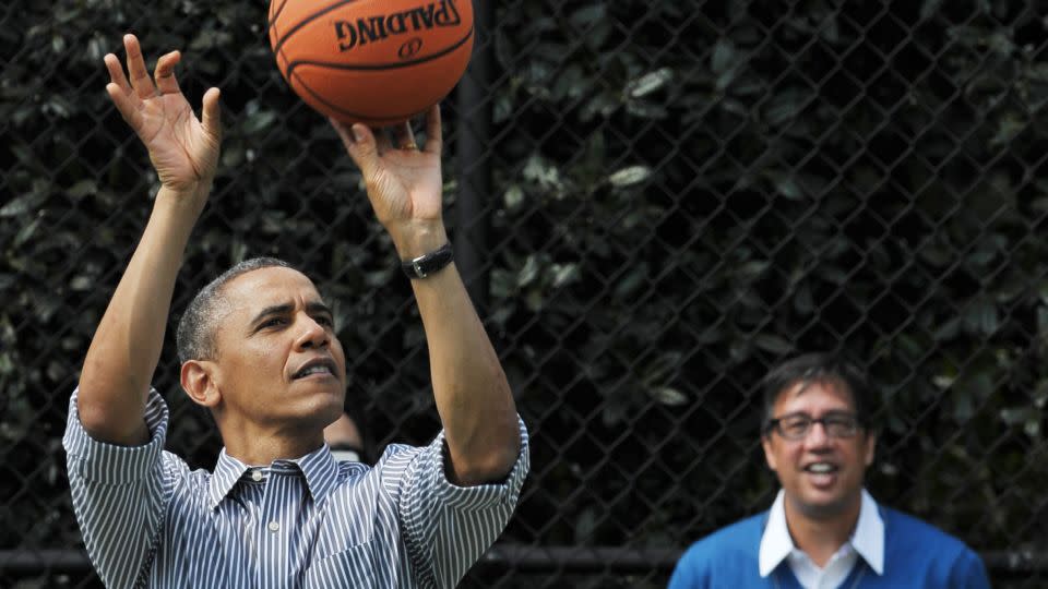 President Barack Obama shoots a basket as his friend Mike Ramos watches during the annual Easter Egg Roll on April 1, 2013, on the South Lawn of the White House. - Mandel Ngan/AFP/Getty Images