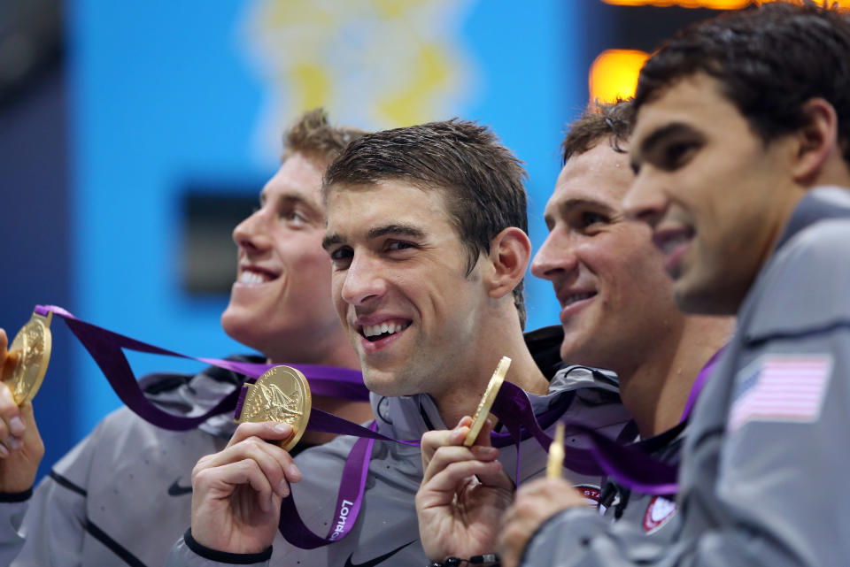LONDON, ENGLAND - JULY 31: (L-R) Gold Medallists , Conor Dwyer, Michael Phelps, Ryan Lochte and Ricky Berens of the United States pose with the medals won the Men's 4 x 200m Freestyle Relay final on Day 4 of the London 2012 Olympic Games at the Aquatics Centre on July 31, 2012 in London, England. (Photo by Ian MacNicol/Getty Images)