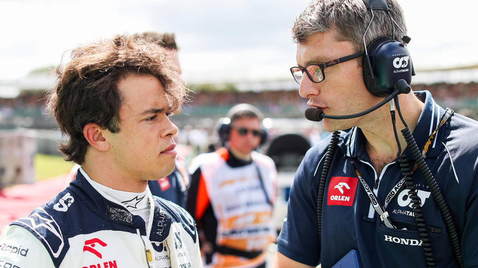 Nyck de Vries speaks with an Alpha Tauri engineer at the British Grand Prix.