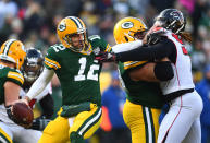 <p>Aaron Rodgers #12 of the Green Bay Packers attempts to get away from Takkarist McKinley #98 of the Atlanta Falcons during the first half of a game at Lambeau Field on December 09, 2018 in Green Bay, Wisconsin. (Photo by Stacy Revere/Getty Images) </p>