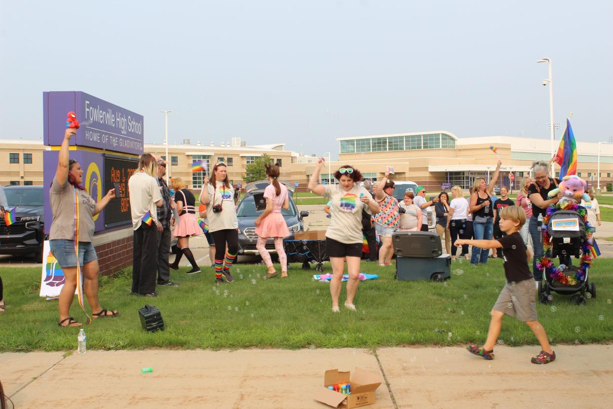 Members of Stand Against Extremism LivCo hold an "Allies for Acceptance" demonstration in front of Fowlerville High School on Tuesday, Aug. 1, 2023.