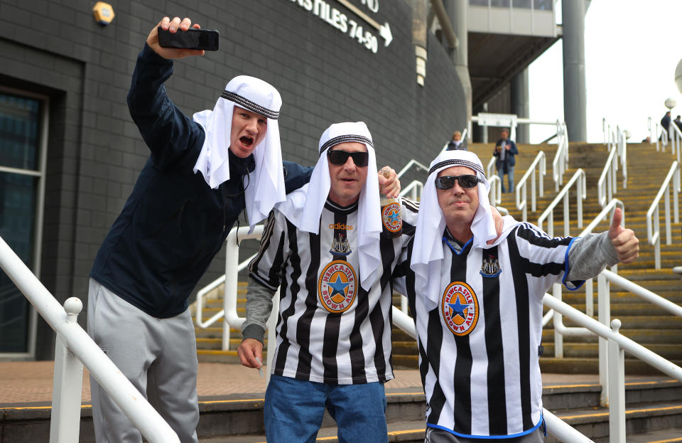 Fans of Newcastle United dressed in Arabian gear at the Premier League match between Newcastle United and Tottenham Hotspur. 