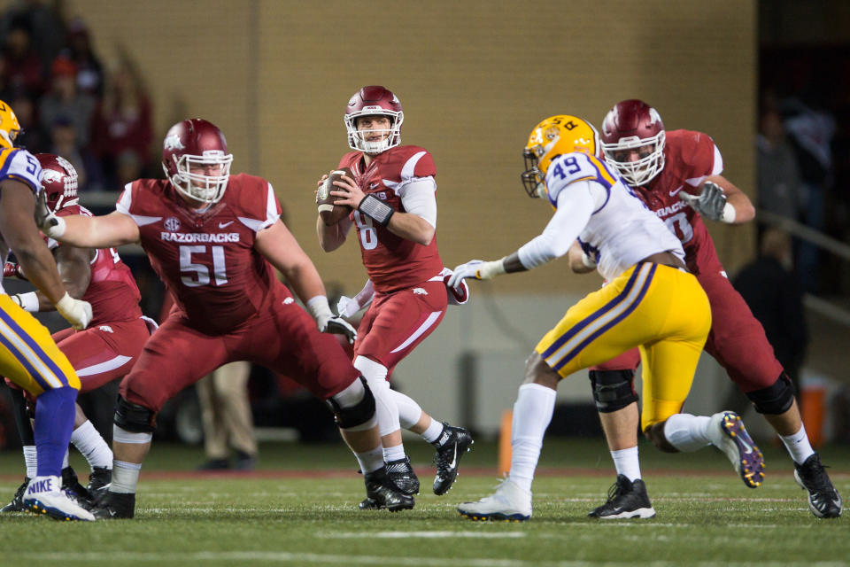 Nov 12, 2016; Fayetteville, AR, USA; Arkansas Razorbacks quarterback Austin Allen (8) looks for a receiver as offensive lineman Hjalte Froholdt (51) and offensive lineman Dan Skipper (70) blocks LSU Tigers defensive end Arden Key (49) during the second quarter of the game at Donald W. Reynolds Razorback Stadium. Mandatory Credit: Brett Rojo-USA TODAY Sports