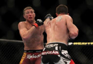 LAS VEGAS, NV - MAY 26: CB Dollaway (right) punches Jason Miller during a middleweight bout at UFC 146 at MGM Grand Garden Arena on May 26, 2012 in Las Vegas, Nevada.