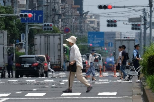 Heat haze distorts the background during a heatwave in Tokyo on July 31