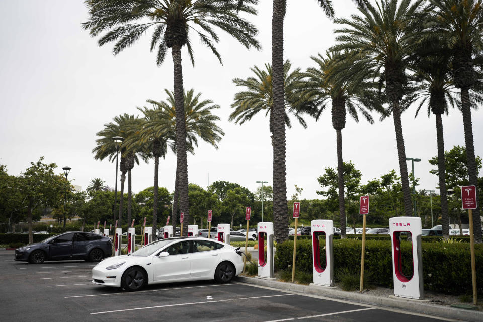 Tesla electric vehicles are charged at a charging station in Anaheim, Calif., Friday, June 9, 2023. Owners of General Motors and Ford electric vehicles will be able charge at many of Tesla's large network of stations across the U.S. starting next year. (AP Photo/Jae C. Hong)