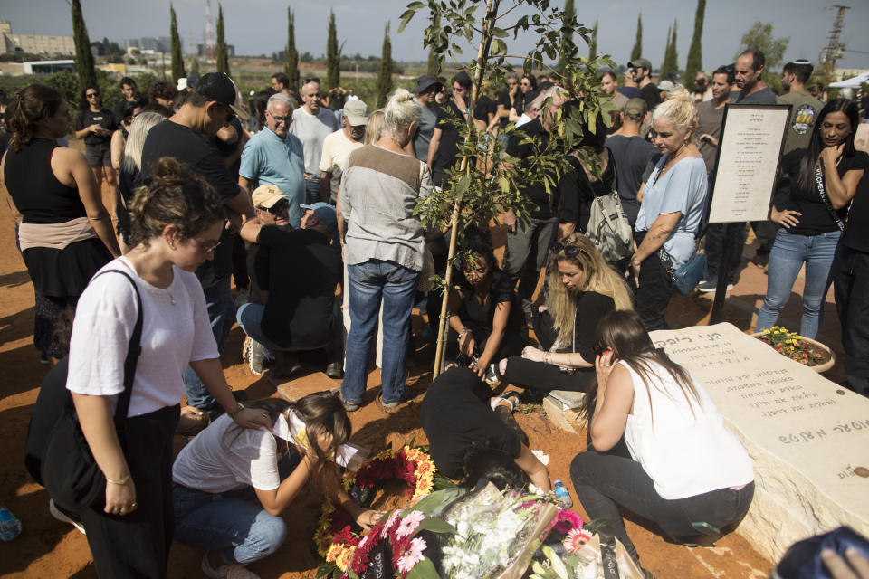 GAN HAIM, ISRAEL - OCTOBER 11:  Family and friends of May Naim, 24, who was murdered by Palestinians militants at the "Supernova" festival, near the Israeli border with Gaza strip, react during her funeral on October 11, 2023 in Gan Haim, Israel. Israel has sealed off Gaza and conducted airstrikes on Palestinian territory after an attack by Hamas killed hundreds and took more than 100 hostages. On October 7, the Palestinian militant group Hamas launched a surprise attack on Israel from Gaza by land, sea, and air, killing over 700 people and wounding more than 2000. Israeli soldiers and civilians have also been taken hostage by Hamas and moved into Gaza. The attack prompted a declaration of war by Israeli Prime Minister Benjamin Netanyahu.  (Photo by Amir Levy/Getty Images)