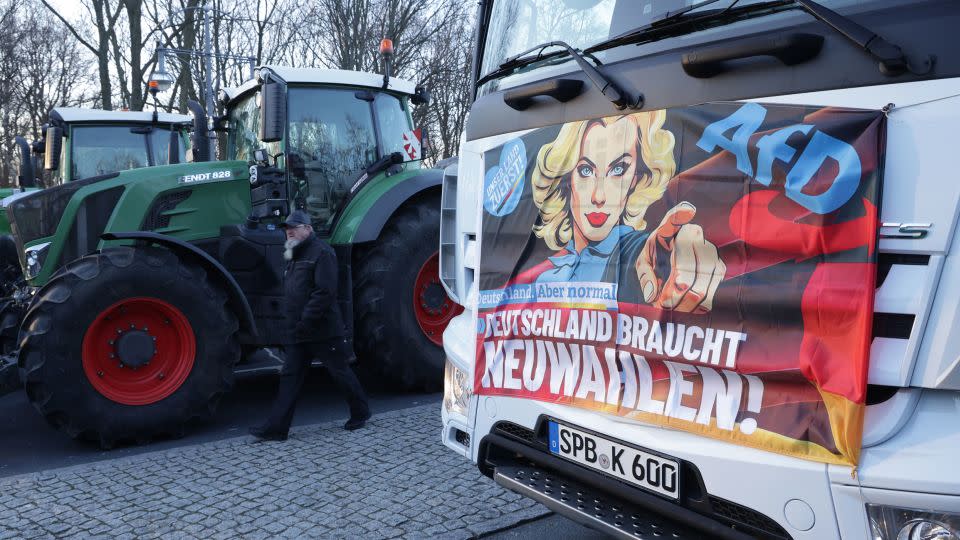 A tractor displays a banner with the logo of the far-right Alternative for Germany (AfD) party that reads: "Germany needs new elections!" - Sean Gallup/Getty Images