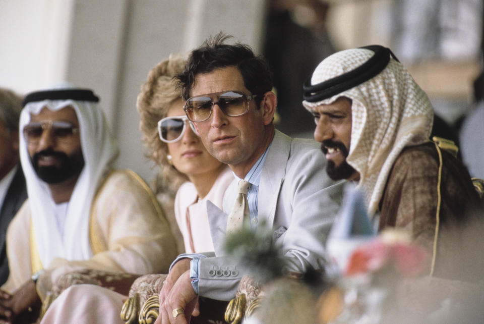 Prince Charles and Diana, Princess of Wales (1961 - 1997) attend a camel race at Al Maqam, near Al Ain in Abu Dhabi in the United Arab Emirates, March 1989. Diana is wearing a pale pink suit by Catherine Walker. (Photo by Jayne Fincher/Princess Diana Archive/Getty Images)