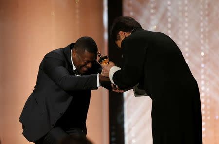 Actor Chris Tucker present Jackie Chan (R) with his Honorary Award at the 8th Annual Governors Awards in Los Angeles, California, U.S., November 12, 2016. REUTERS/Mario Anzuoni