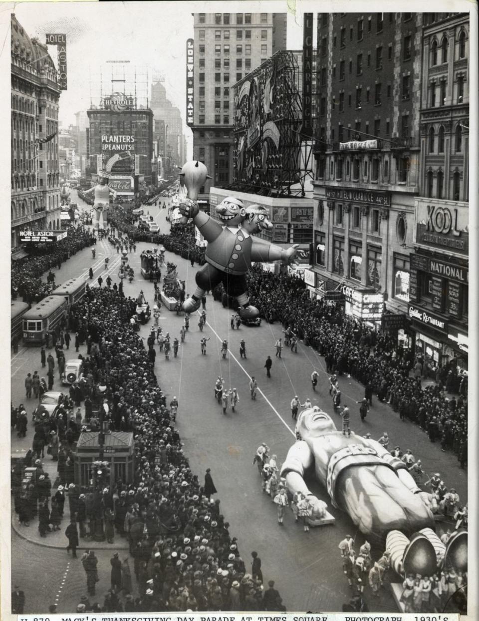 <p>An aerial view of the Macy's Thanksgiving Day Parade passing through Times Square. The parade started back in 1924.</p>