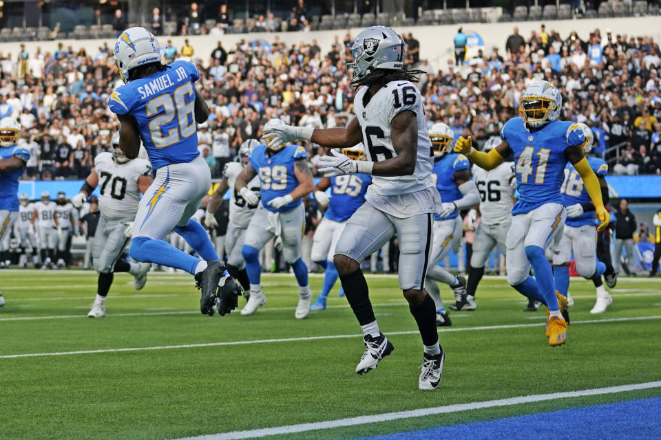 Los Angeles Chargers cornerback Asante Samuel Jr. (26) intercepts a pass intended for Las Vegas Raiders wide receiver Jakobi Meyers (16) during the second half of an NFL football game Sunday, Oct. 1, 2023, in Inglewood, Calif. (AP Photo/Ashley Landis)