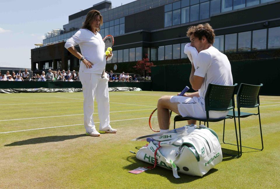 Coach Amelie Mauresmo speaks to Andy Murray of Britain during a practice session at the Wimbledon Tennis Championships in London, July 9, 2015. REUTERS/Suzanne Plunkett