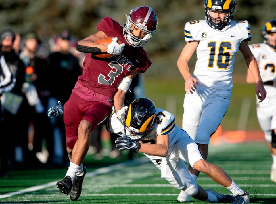 Mt. Lebanon’s Marco Alandete tries to trip up State College’s Jashaun Green during the PIAA class 6A semifinal game on Saturday, Dec. 4, 2021 at Mansion Park. Mt. Lebanon won, 49-28.