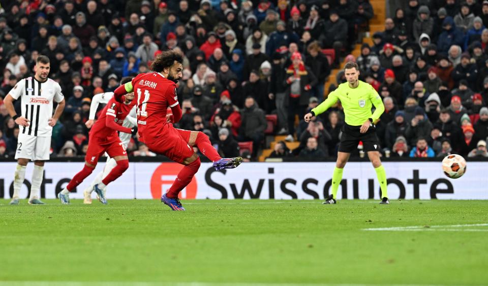 Salah  moves on to 199 club goals with a flawless penalty (Liverpool FC via Getty Images)