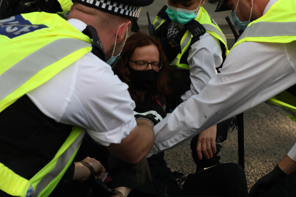 An Extinction Rebellion demonstrator is carried away from Parliament Square, London. The environmental campaign group has planned for marches to be held at several landmarks in the capital, before moving to Parliament Square in Westminster. (Photo by Luciana Guerra/PA Images via Getty Images)