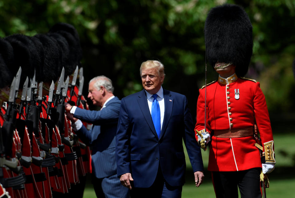 US President Donald Trump (R) inspects the honour guard with Britain's Prince Charles, Prince of Wales (L) during a welcome ceremony at Buckingham Palace in central London on June 3, 2019, on the first day of the US president and First Lady's three-day State Visit to the UK. - Britain rolled out the red carpet for US President Donald Trump on June 3 as he arrived in Britain for a state visit already overshadowed by his outspoken remarks on Brexit. (Photo by TOBY MELVILLE / POOL / AFP)        (Photo credit should read TOBY MELVILLE/AFP/Getty Images)