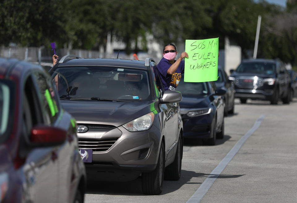 A protester at Miami International Airport on May 12, 2020, where workers were demonstrating against layoffs by the Eulen America aviation company.<span class="copyright">Joe Raedle—Getty Images</span>